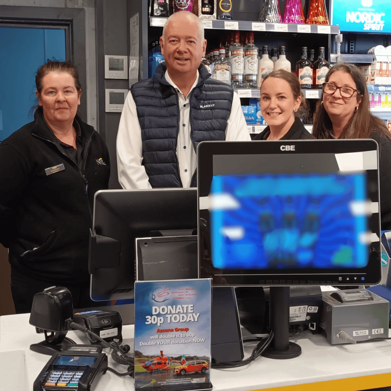 Three employees at Ascone with Darren Briggs the CEO