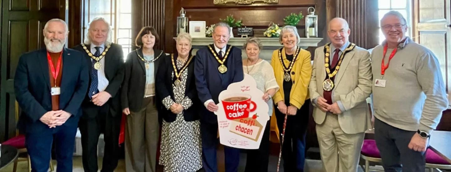 A group of individuals supporting the coffee and cake event